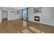Bright living room featuring a fireplace, wood floors, and large windows at 1481 Rancho Ridge Dr, Henderson, NV 89012