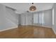 Bright living room with hardwood floors, staircase, and neutral walls at 1481 Rancho Ridge Dr, Henderson, NV 89012
