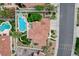 Aerial view of a home with a pool, spa, patio, tile roof, and a landscaped backyard at 150 Wentworth Dr, Henderson, NV 89074