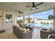 Cozy covered patio offers a lounge area overlooking a private pool and a lush, landscaped backyard at 150 Wentworth Dr, Henderson, NV 89074