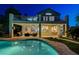 Backyard featuring a pool, covered patio with ceiling fans, and outdoor seating area at 150 Wentworth Dr, Henderson, NV 89074