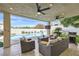 Inviting backyard with a covered patio, swimming pool, lush greenery, and an outdoor seating area at 150 Wentworth Dr, Henderson, NV 89074
