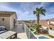 Upper-level balcony with comfortable seating, offering panoramic views of the surrounding neighborhood and lush landscaping at 150 Wentworth Dr, Henderson, NV 89074
