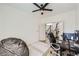 Bedroom features neutral walls, a ceiling fan, and an adjacent room, providing flex space at 150 Wentworth Dr, Henderson, NV 89074
