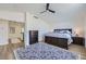 Primary bedroom features a high ceiling, ceiling fan, and access to an adjacent room at 150 Wentworth Dr, Henderson, NV 89074