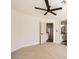 Bright bedroom has modern ceiling fan, carpeted floor, and view into the bathroom at 150 Wentworth Dr, Henderson, NV 89074