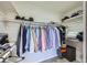 Walk-in closet with rods for hanging clothes, shelves, and space for storage at 150 Wentworth Dr, Henderson, NV 89074