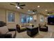 Relaxing covered patio with stylish seating, ceiling fans, and views of the landscaped backyard at 150 Wentworth Dr, Henderson, NV 89074