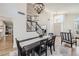 Dining area boasts a large table, bench seating, and is conveniently located near the staircase and front door at 150 Wentworth Dr, Henderson, NV 89074