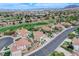 Well-maintained home in a desirable neighborhood, featuring a golf course view, mature trees, and manicured lawns at 150 Wentworth Dr, Henderson, NV 89074