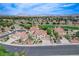 Charming home nestled in a green neighborhood, featuring mature landscaping, a golf course, and well-maintained streets at 150 Wentworth Dr, Henderson, NV 89074