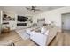 Living room featuring a modern fireplace, ceiling fan, recessed lighting, and stylish neutral decor at 150 Wentworth Dr, Henderson, NV 89074