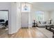 Bright foyer featuring a high ceiling, hardwood floors, and a view into the living room at 150 Wentworth Dr, Henderson, NV 89074