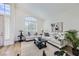 Airy living room with high ceilings, plantation shutters, neutral decor, and stylish furnishings at 150 Wentworth Dr, Henderson, NV 89074