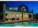 Relaxing covered patio with comfortable seating, ceiling fans, and views of the sparkling pool, ideal for outdoor living at 150 Wentworth Dr, Henderson, NV 89074