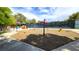 A colorful playground area featuring various play structures and a wood chip ground cover at 150 Wentworth Dr, Henderson, NV 89074