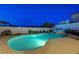 Tranquil backyard pool and spa with lush landscaping and serene ambiance at twilight at 150 Wentworth Dr, Henderson, NV 89074