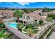 Gorgeous backyard with a sparkling pool, spa, patio, and lush landscaping that offers a serene outdoor space at 150 Wentworth Dr, Henderson, NV 89074