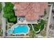Aerial view of a home with a private pool, spa, upper deck, outdoor seating, and manicured landscaping at 150 Wentworth Dr, Henderson, NV 89074