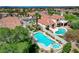 Expansive backyard showcasing a sparkling pool, spa, lush landscaping, and generous space for outdoor activities at 150 Wentworth Dr, Henderson, NV 89074