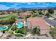 Stunning outdoor space with a pool, spa, patio, upper deck and well-manicured landscaping, ideal for relaxation at 150 Wentworth Dr, Henderson, NV 89074