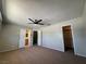 Bright bedroom with ceiling fan, closet and ensuite bathroom at 173 Greenbriar Townhouse Way, Las Vegas, NV 89121