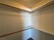 Spacious walk-in closet with wood shelving at 173 Greenbriar Townhouse Way, Las Vegas, NV 89121