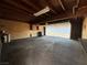 Spacious garage offering ample storage space, featuring a high ceiling and convenient access to exterior parking at 173 Greenbriar Townhouse Way, Las Vegas, NV 89121