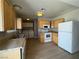 Well-lit kitchen boasting laminate floors, practical appliances, and plenty of storage at 173 Greenbriar Townhouse Way, Las Vegas, NV 89121