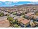 Expansive aerial view of a community featuring well-maintained homes and scenic mountain backdrop at 1794 Morro Vista Dr, Las Vegas, NV 89135