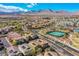 Expansive aerial view of a community featuring well-maintained homes and scenic mountain backdrop at 1794 Morro Vista Dr, Las Vegas, NV 89135