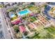 Aerial view of neighborhood featuring pools, park, playgrounds and manicured landscaping at 1794 Morro Vista Dr, Las Vegas, NV 89135