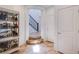 Entry way with staircase and tile flooring, cabinet with crystal chandelier view at 1794 Morro Vista Dr, Las Vegas, NV 89135