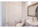 Elegant powder room with pedestal sink, decorative mirror and stylish lighting at 1794 Morro Vista Dr, Las Vegas, NV 89135