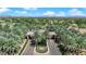 Aerial view of the 'Grand Legacy' community entrance displays manicured landscaping, offering a glimpse into its exclusive ambiance at 1848 Indian Bend Dr, Henderson, NV 89074