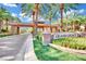 Grand Legacy community entrance with stone signage and lush landscaping, creating a welcoming and prestigious feel at 1848 Indian Bend Dr, Henderson, NV 89074