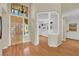 Inviting foyer with hardwood floors, chandelier, and a view into the home office at 1848 Indian Bend Dr, Henderson, NV 89074