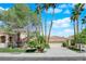 Charming single-story home with well-manicured front yard, lush greenery, and a two-car garage, offering great curb appeal at 1848 Indian Bend Dr, Henderson, NV 89074