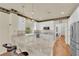 Modern kitchen with stainless steel appliances, granite countertops, and breakfast bar seating at 1848 Indian Bend Dr, Henderson, NV 89074