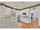 Bright kitchen with white cabinets, granite countertops, and stainless steel appliances at 1848 Indian Bend Dr, Henderson, NV 89074