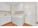 Clean, well-maintained laundry room with ample storage and modern washer and dryer at 1848 Indian Bend Dr, Henderson, NV 89074
