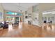 Spacious living room featuring hardwood floors, a fireplace, built-in cabinets, and large windows offering ample natural light at 1848 Indian Bend Dr, Henderson, NV 89074