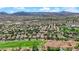 Scenic aerial shot of a Gathering-friendly neighborhood bordering a golf course offering a blend of recreation and residential living at 1848 Indian Bend Dr, Henderson, NV 89074