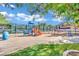 Community playground with colorful equipment, offering a fun and safe play area for near well-maintained landscaping at 1848 Indian Bend Dr, Henderson, NV 89074