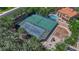 An aerial photograph of community tennis courts and playground area shows a recreational lifestyle at 1848 Indian Bend Dr, Henderson, NV 89074