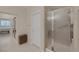 Shower stall with textured door and adjacent closet in light and airy bathroom at 1912 Summer Pine Ct # 103, Las Vegas, NV 89134