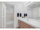 Bright bathroom with white tile, countertop and view of shower at 1912 Summer Pine Ct # 103, Las Vegas, NV 89134