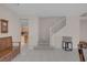 Entryway showcasing staircase, dining area, and kitchen with sleek tile flooring at 1912 Summer Pine Ct # 103, Las Vegas, NV 89134