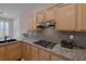 Kitchen featuring granite countertops, gas range, and stainless-steel appliances at 1912 Summer Pine Ct # 103, Las Vegas, NV 89134
