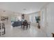 Open-concept living area with tile floors, lots of light, and dining area at 1912 Summer Pine Ct # 103, Las Vegas, NV 89134
